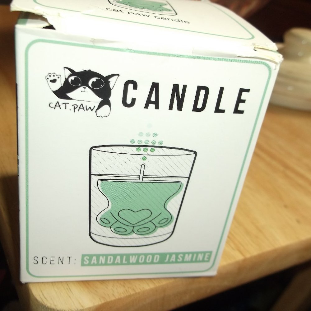 new in the box cat paw gel candle. sandal wood jasmine .